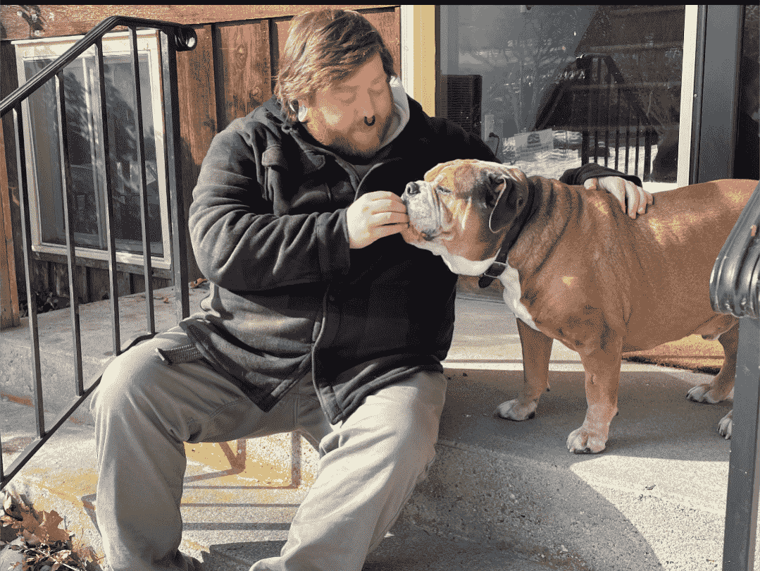 Richie Giving Buddy Bulldog a treat