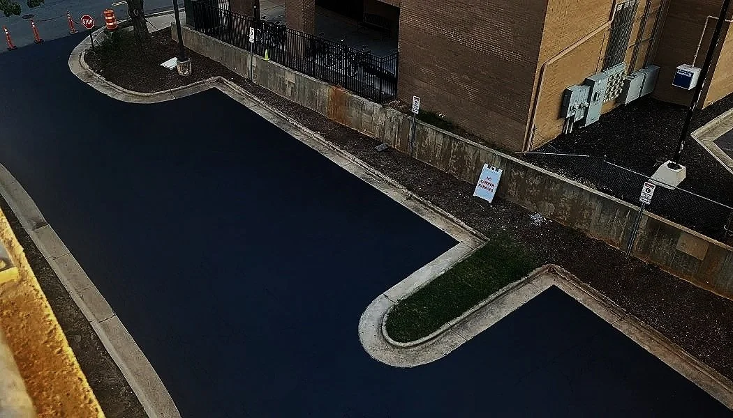 SealCoating - 
Your asphalt works hard every day—facing sun, rain, snow, traffic, and spills. Over time, that wear and tear can lead to cracks, potholes, and costly repairs. Sealcoating is your pavement’s armor, creating a protective barrier that loc