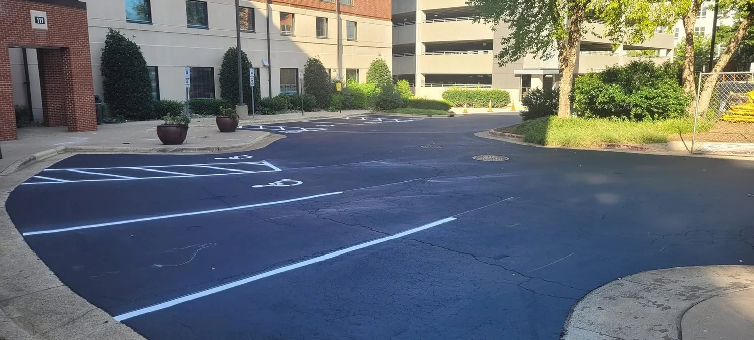 Commercial parking lot after seal coating and line striping in Raleigh, NC
