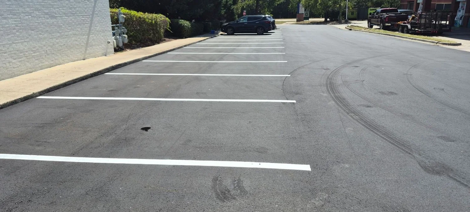 Parking lot after repair, sealcoating and restriping