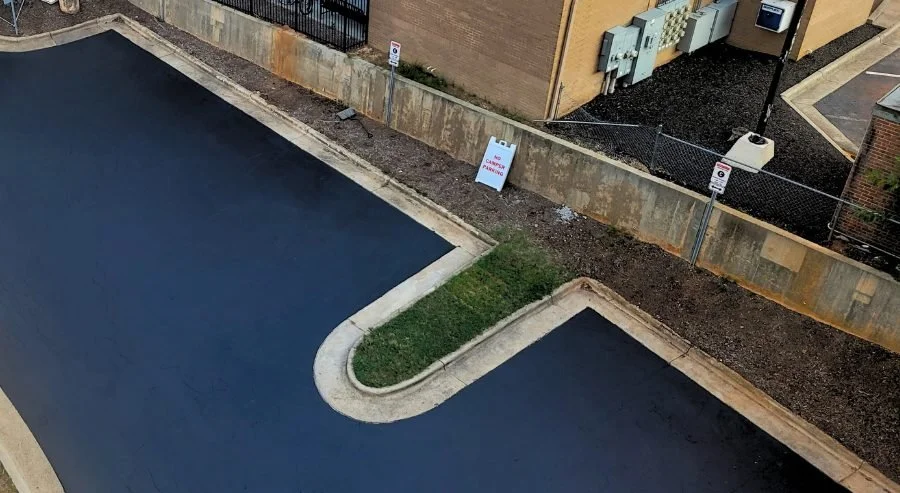 Freshly seal coated parking lot in Raleigh, NC