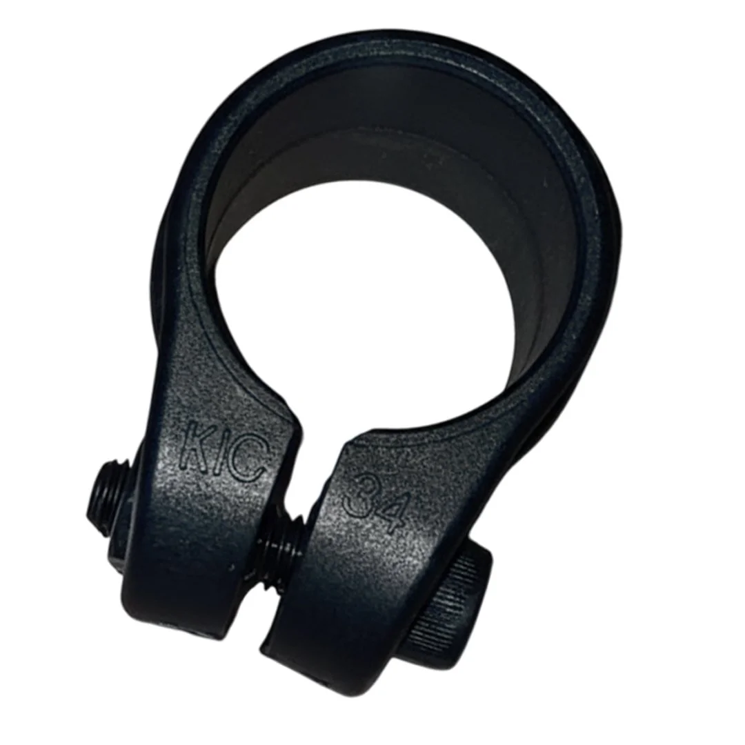 Close-up of a black metal clamp with visible screws and numbered markings