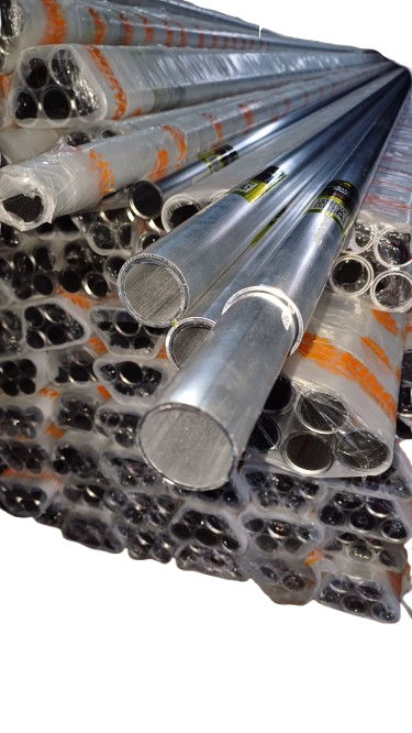 A close-up of stacked metal pipes, some wrapped in plastic and others unwrapped, showing the hollow tube structure.