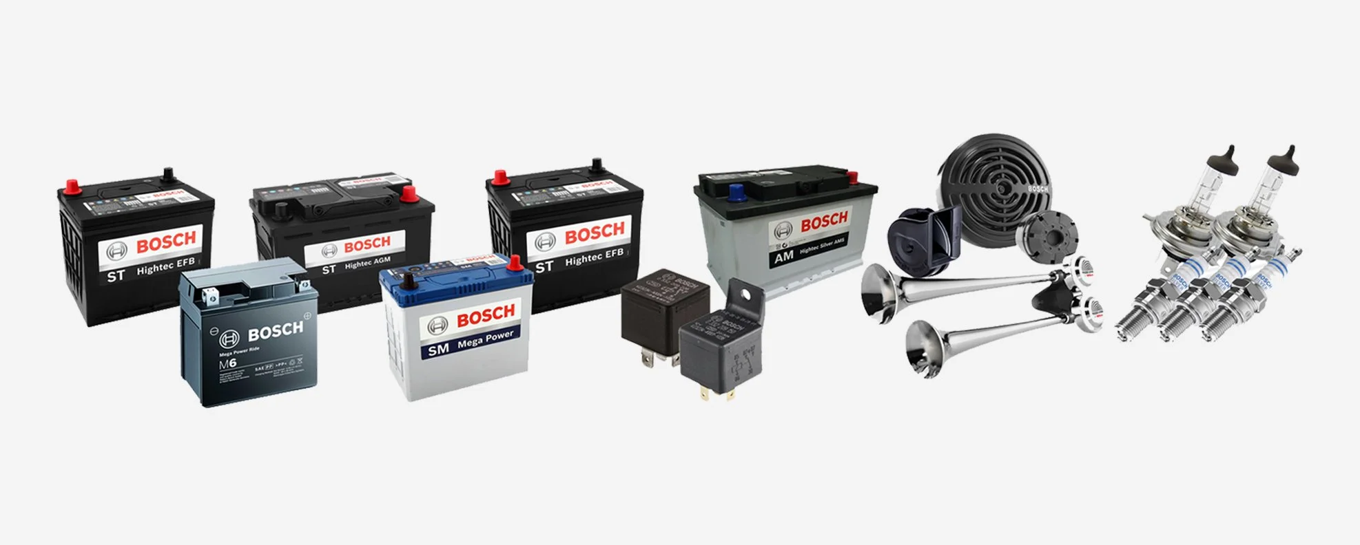 Various automotive parts including car batteries, relays, speakers, bulbs, and filters displayed in a row on a white background.