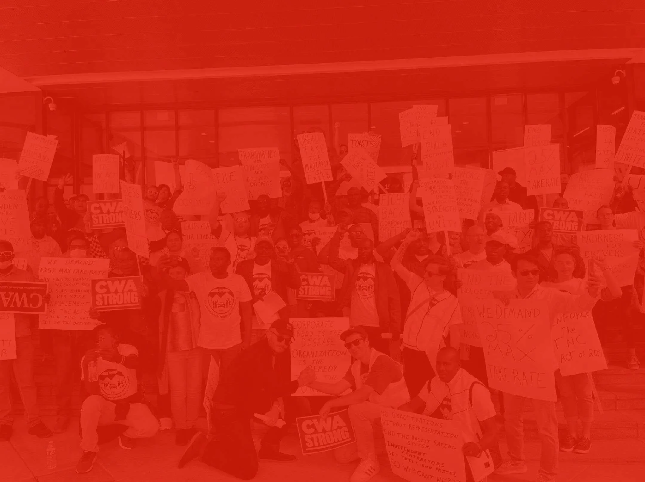 union members holding signs that say CWA strong