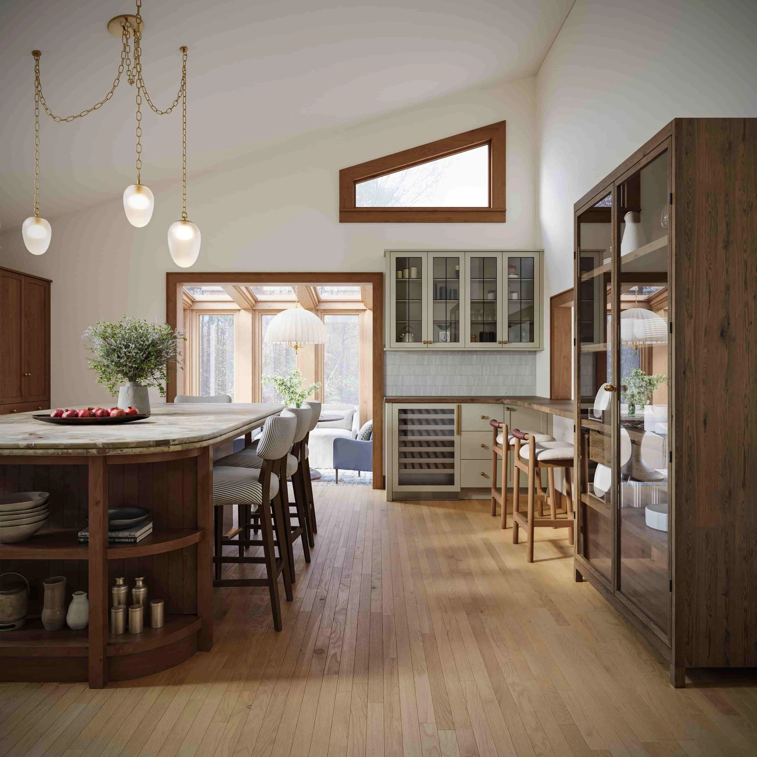 Modern kitchen with a curved island, barstools, glass-front cabinets, a wine fridge, and a seating area with windows and natural light.