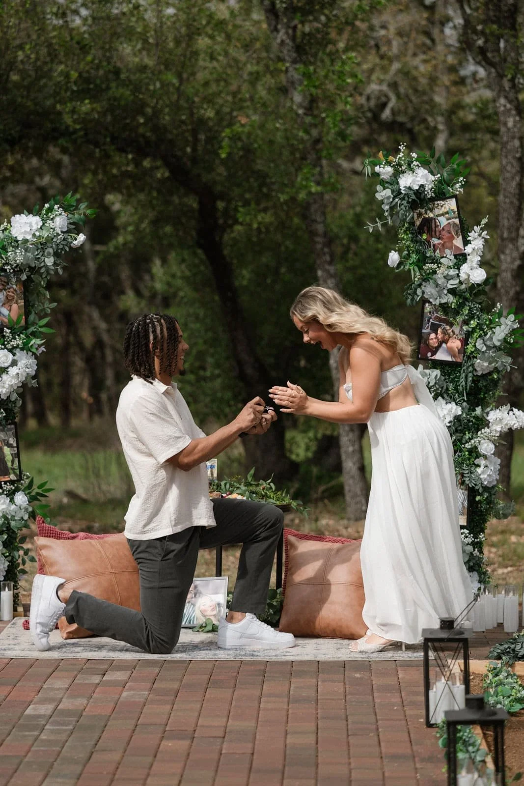 A couple getting engaged outdoors at Wrenwood Ranch in Fredericksburg texas