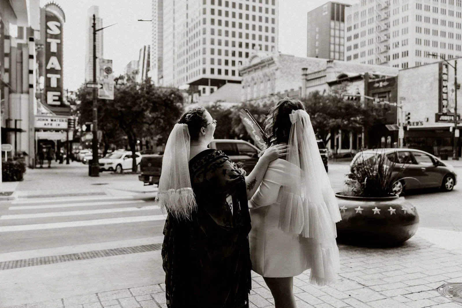 black and white image of two brides in downtown Austin, TX