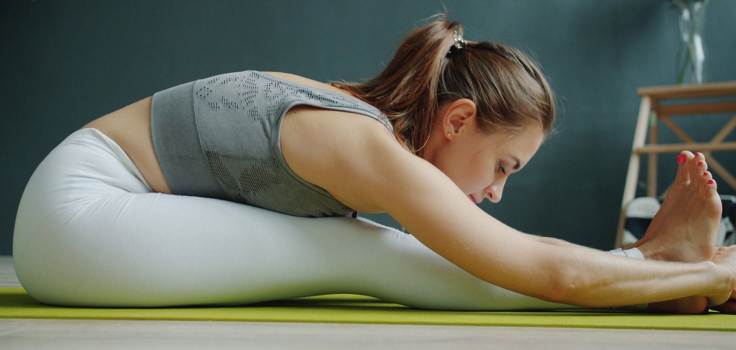 Woman stretching for pelvic floor care