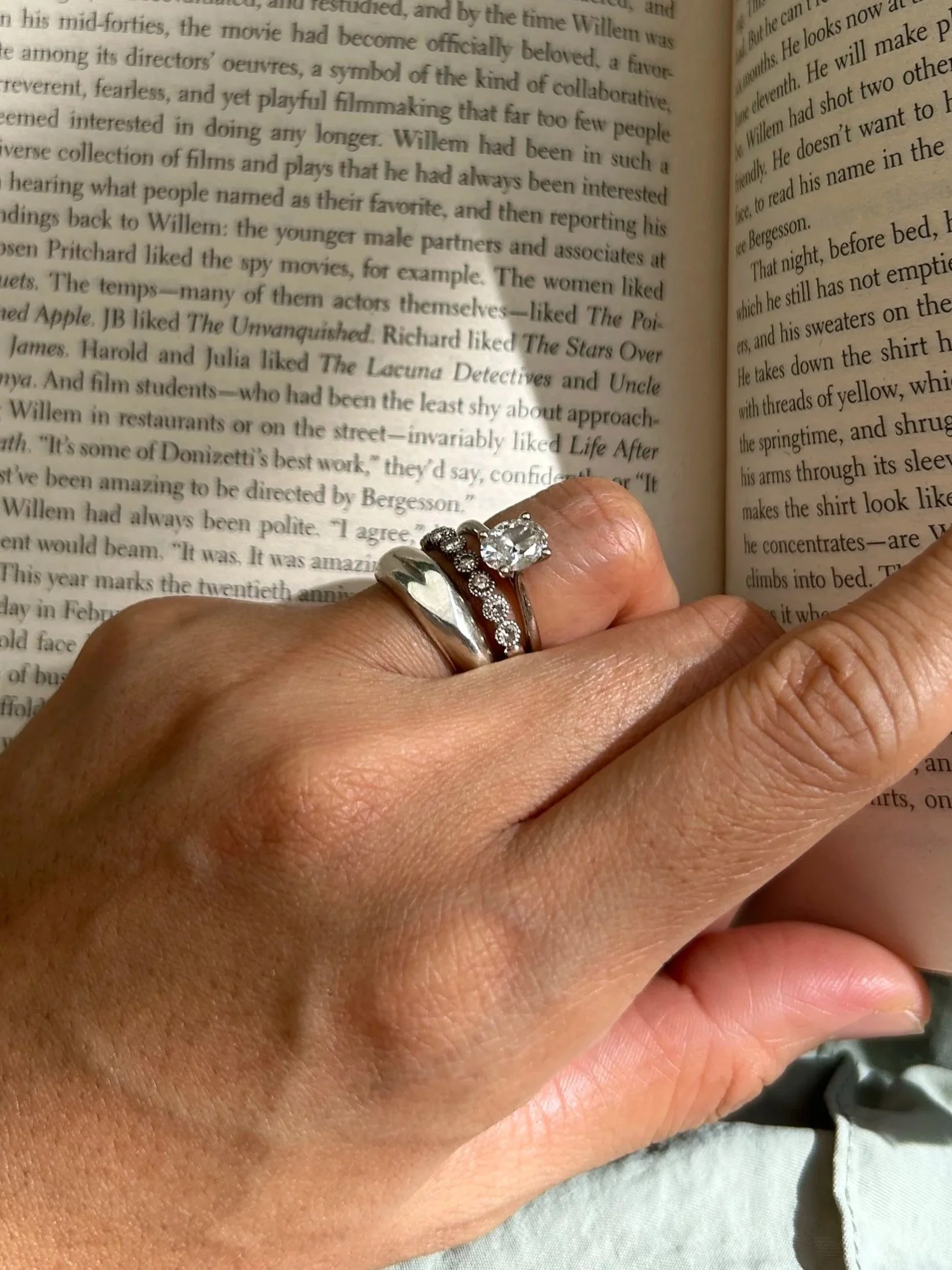 The Heart Ring stacked with milestone pieces