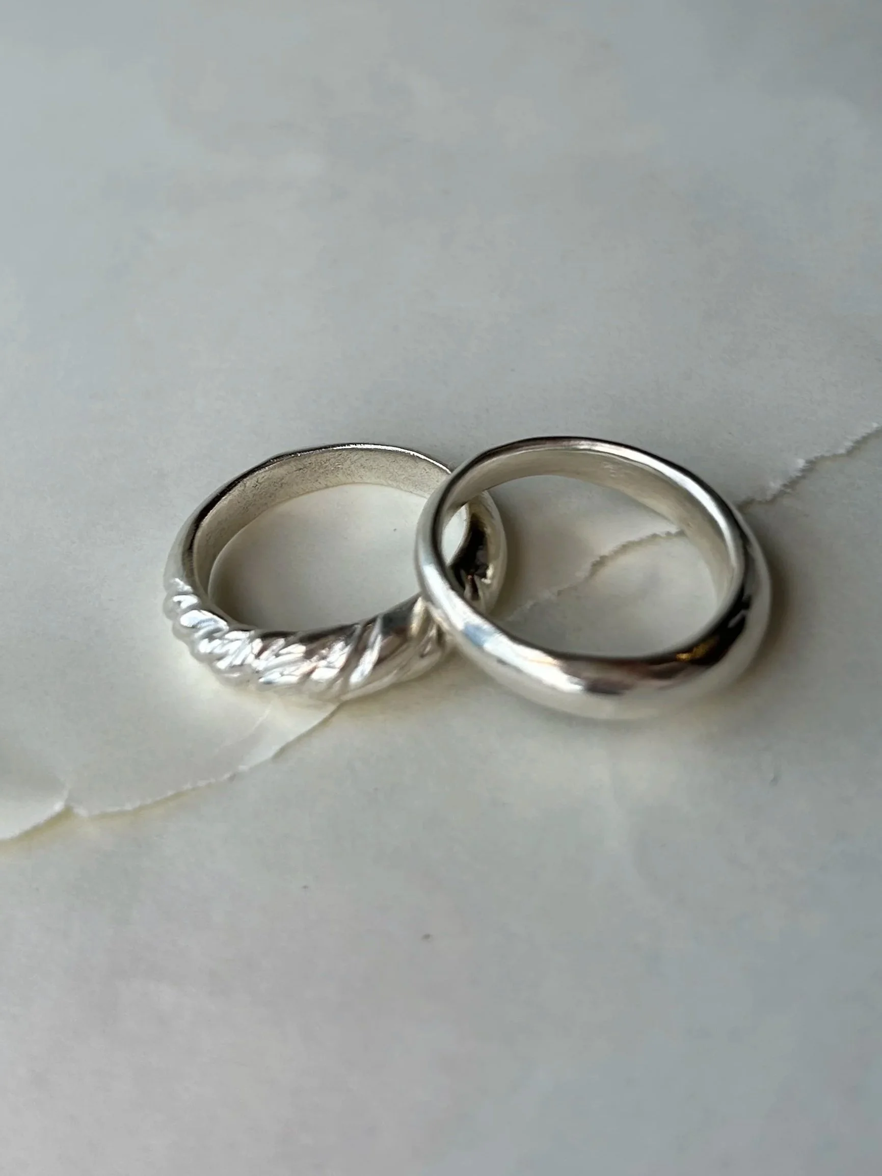 The Daring - a textured and tapered sterling silver ring with The Core - a minimalist tapered sterling silver ring