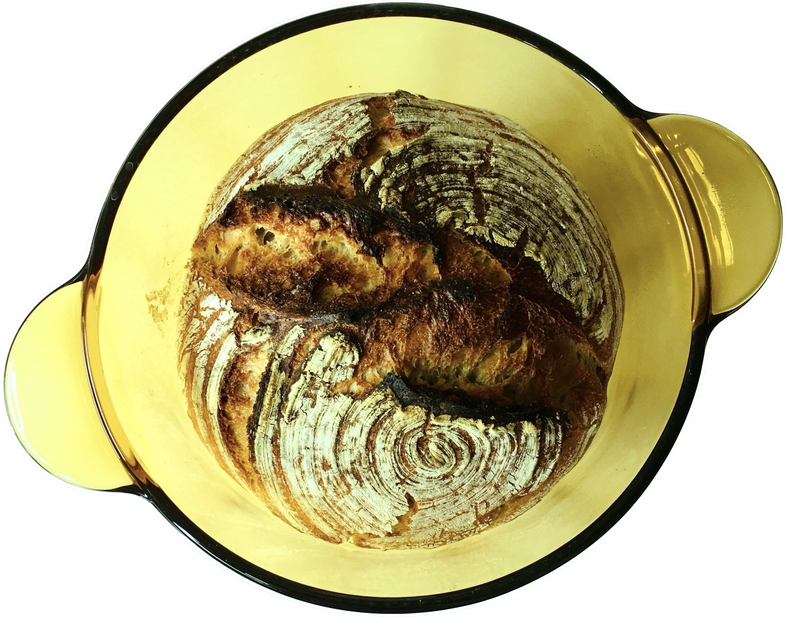 A negative of a burnt pineapple upside-down cake seen in a yellow baking dish.