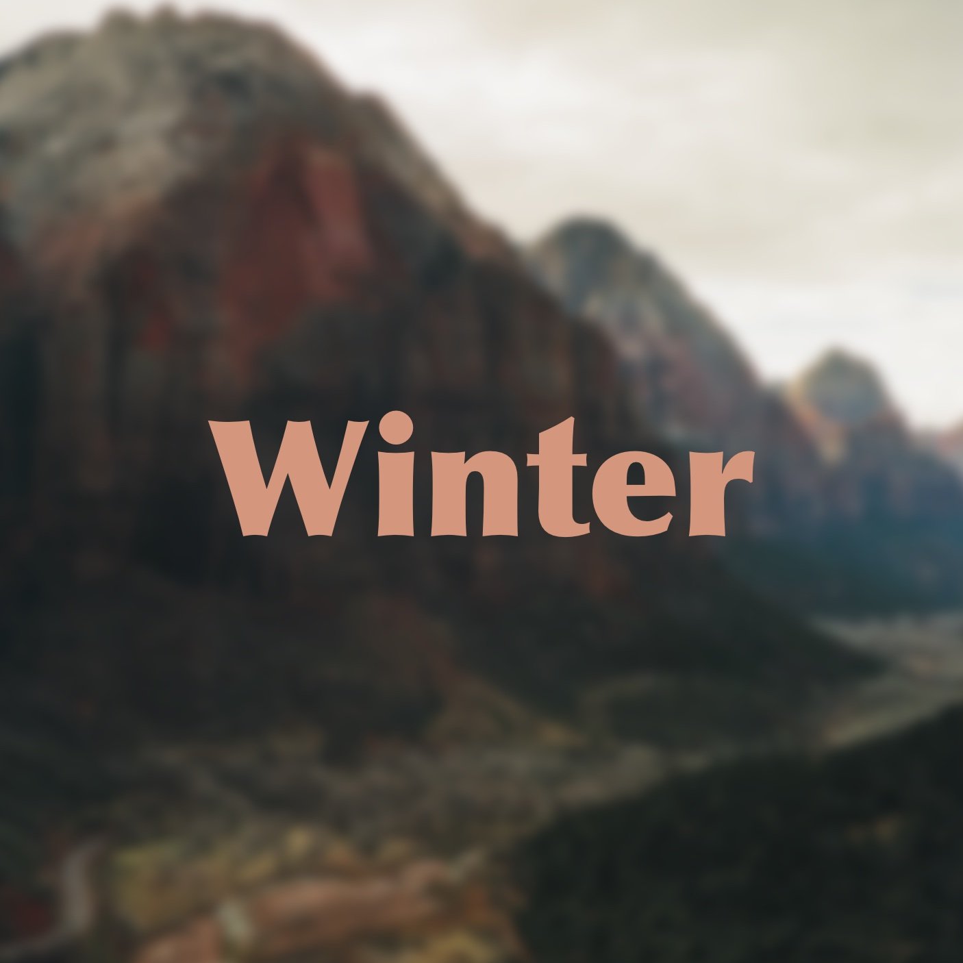 Blurred landscape with mountains and cloudy sky, overlaid with the word 'Winter' in pink text.