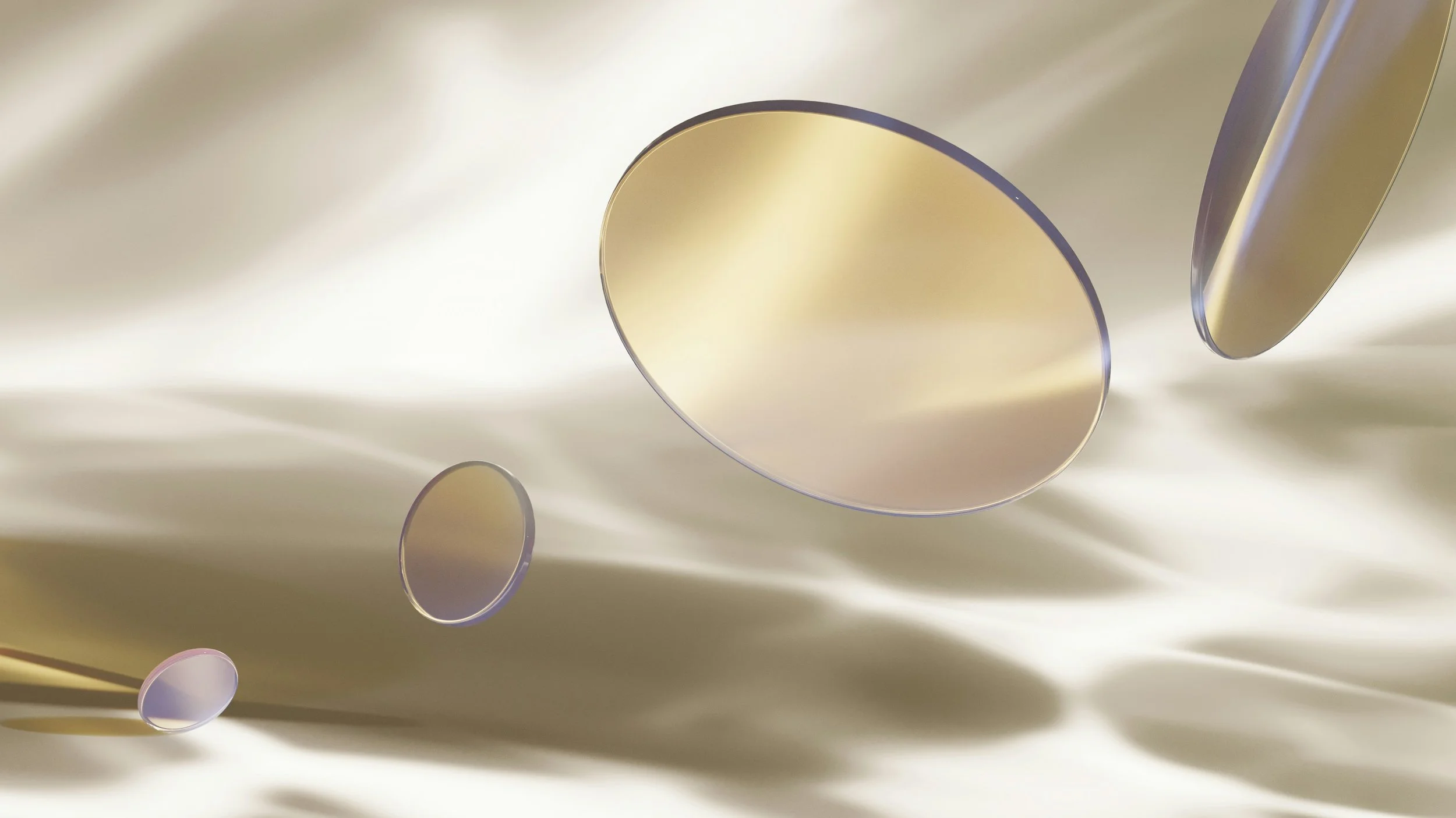 Floating gold and purple metallic mirrors reflecting light against a silky, smooth cream-colored background.