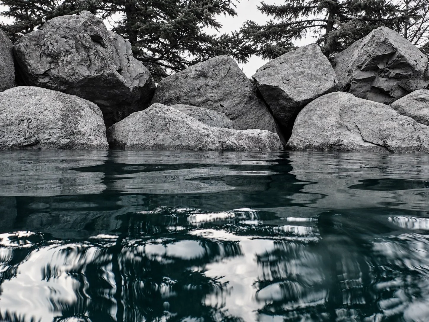 Boulders and teal reflections