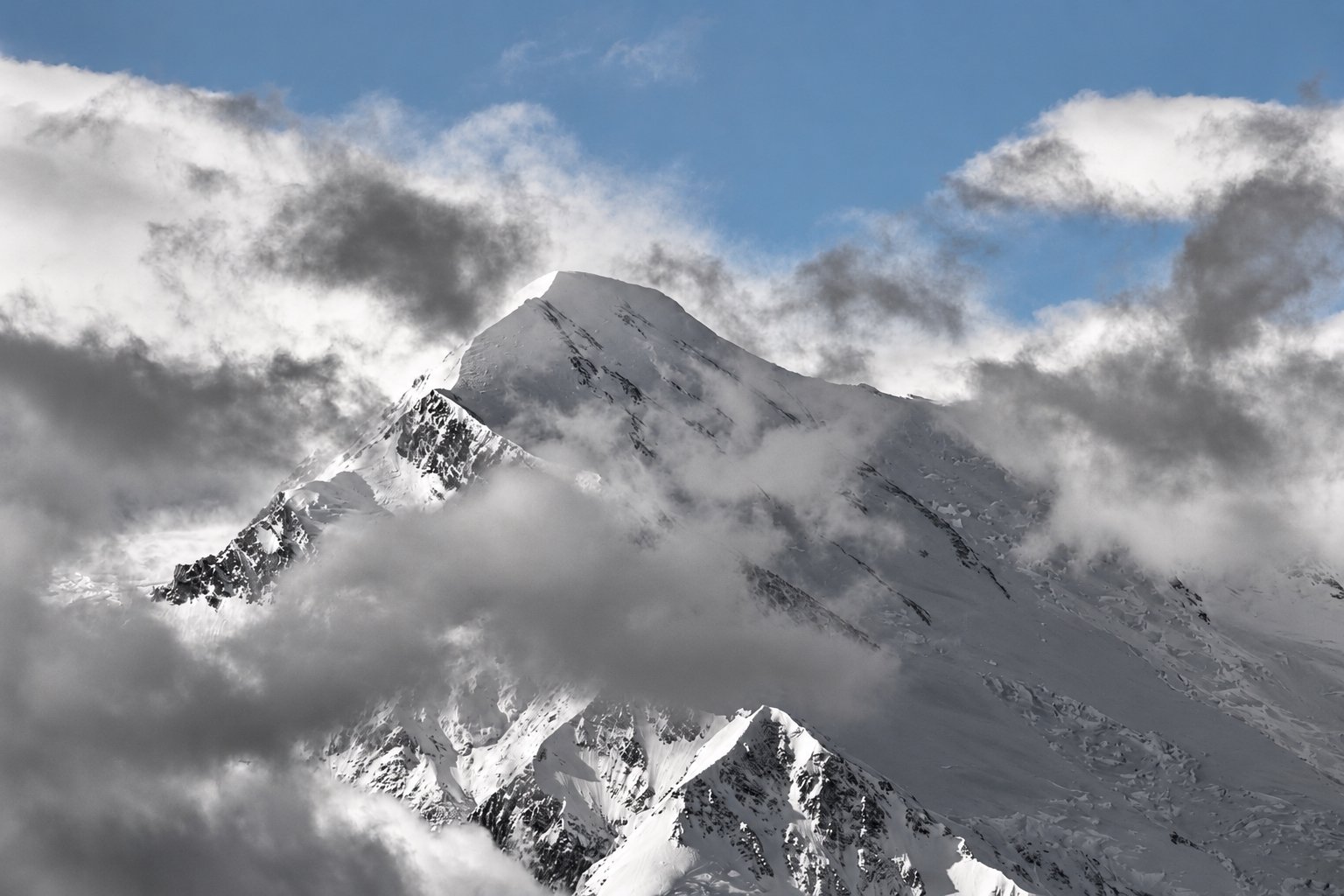 Snowy mountain with blue sky