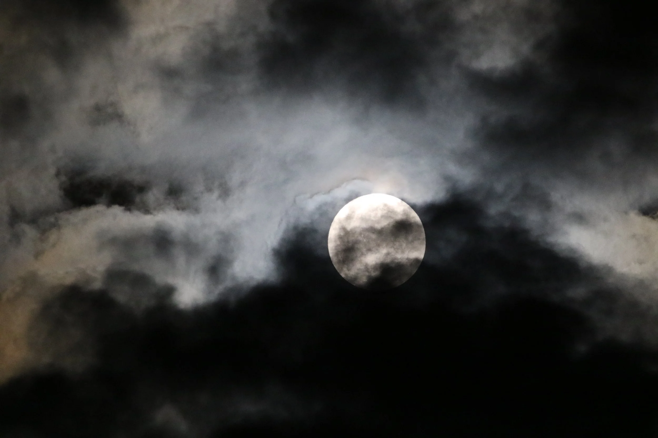clouds in front of moon