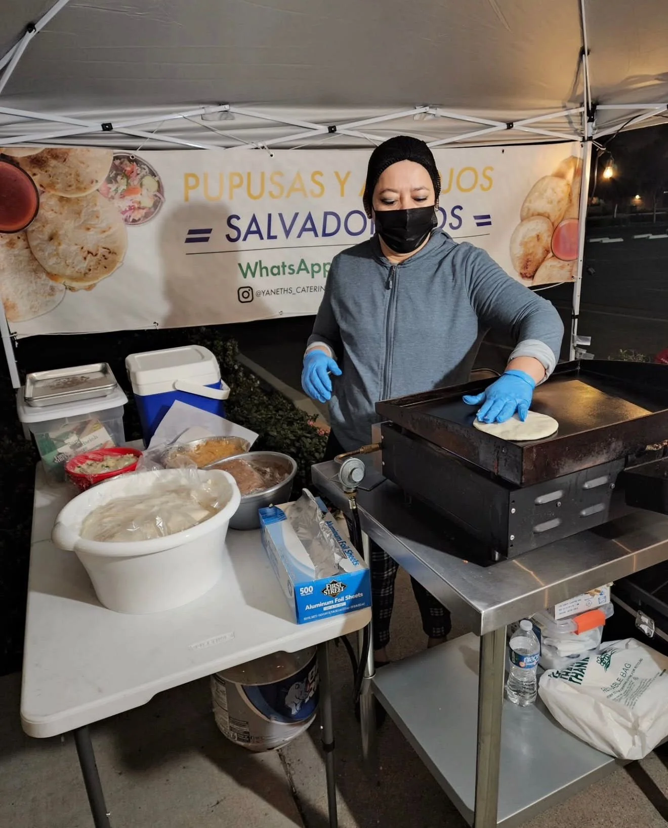 Pupusas de la Reina Restaurant founder at a street pop-up