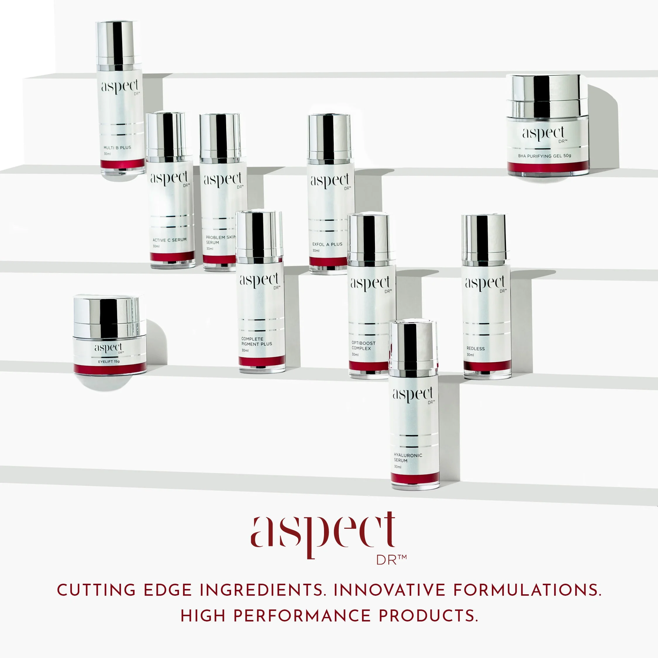 A display of skincare products with white and silver bottles on white shelves, including serums and gels, branded as 'AspectDR' and labeled with product names, set against a plain white background.