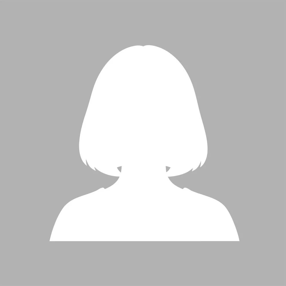 Silhouette of a person with shoulder-length hair on a gray background.