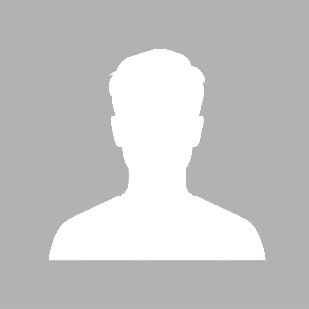 Silhouette of a person's head and shoulders on a gray background.