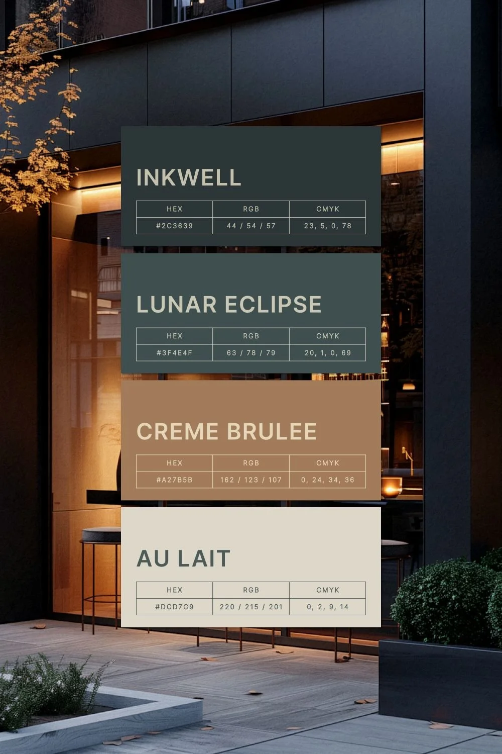 Signboard displaying four color names with their respective HEX, RGB, and CMYK color codes against a modern building background at dusk.