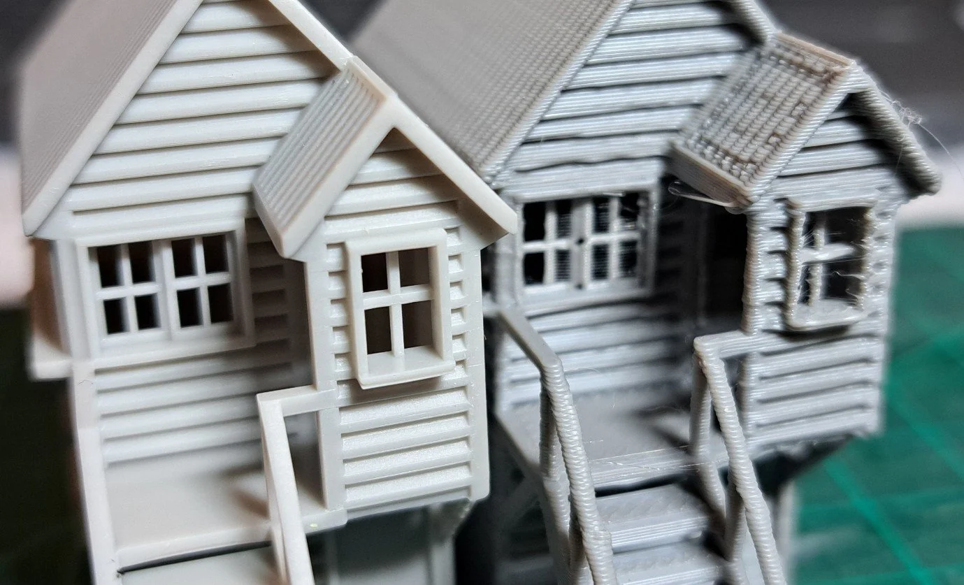 Close-up of the difference between FDM and SLA printed products.