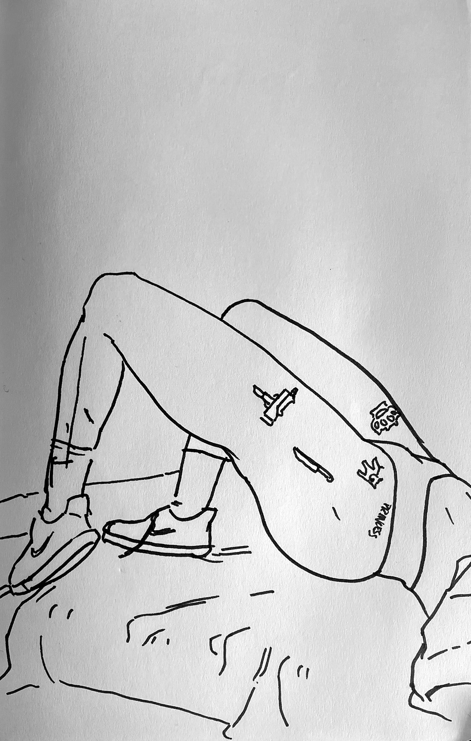 Line drawing of a person lying on a couch with legs crossed and propped up, with various small objects on their torso, including a spray paint can, a knife, a crown, and an electronic device.