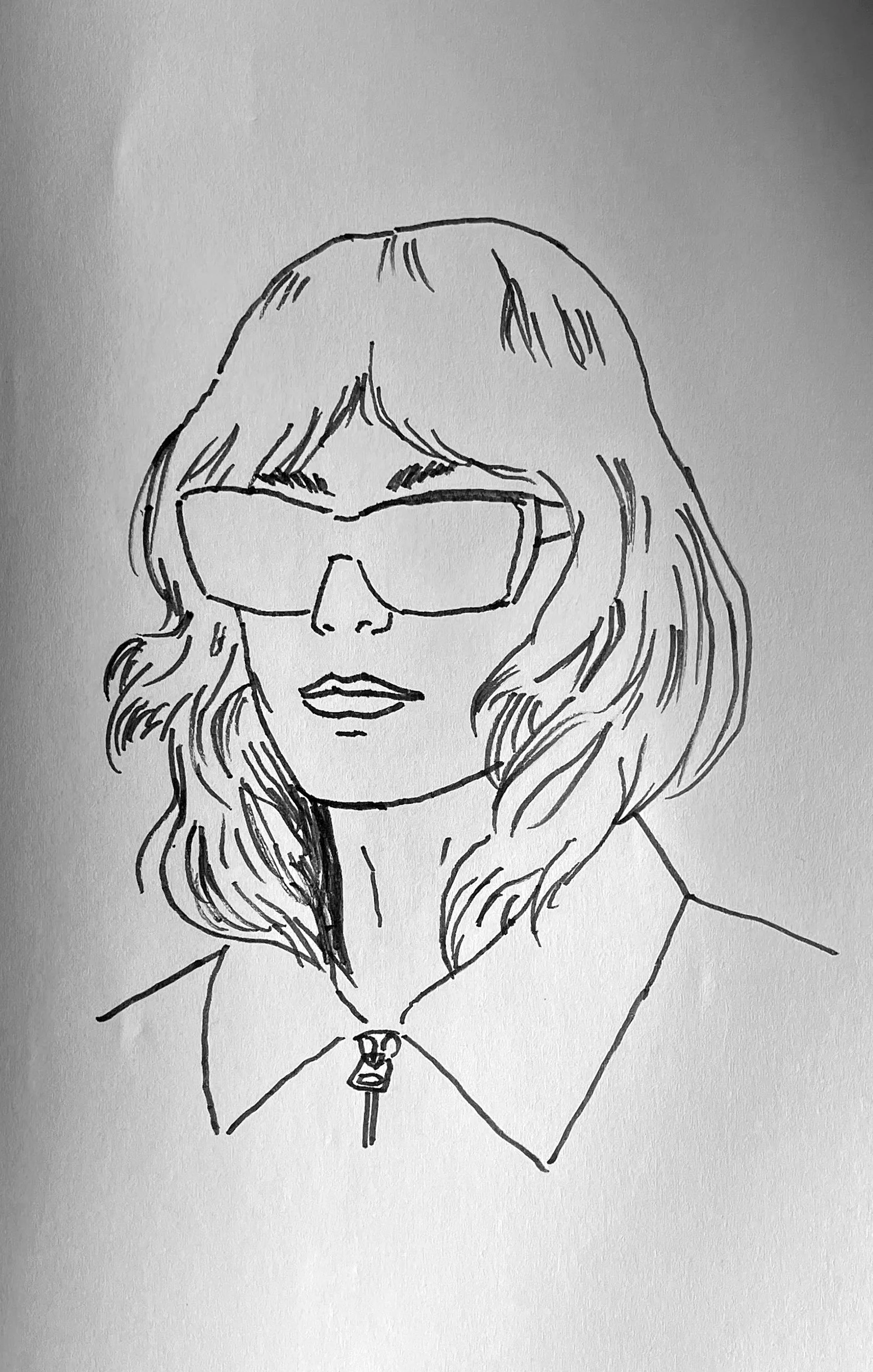 Line drawing of a woman with shoulder-length wavy hair, wearing large glasses, a collared jacket, and a zipper, facing forward.