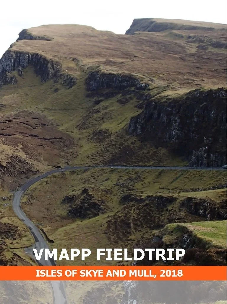 Scenic view of a winding road through hills and cliffs on the Isle of Skye and Mull, Scotland, during daytime.