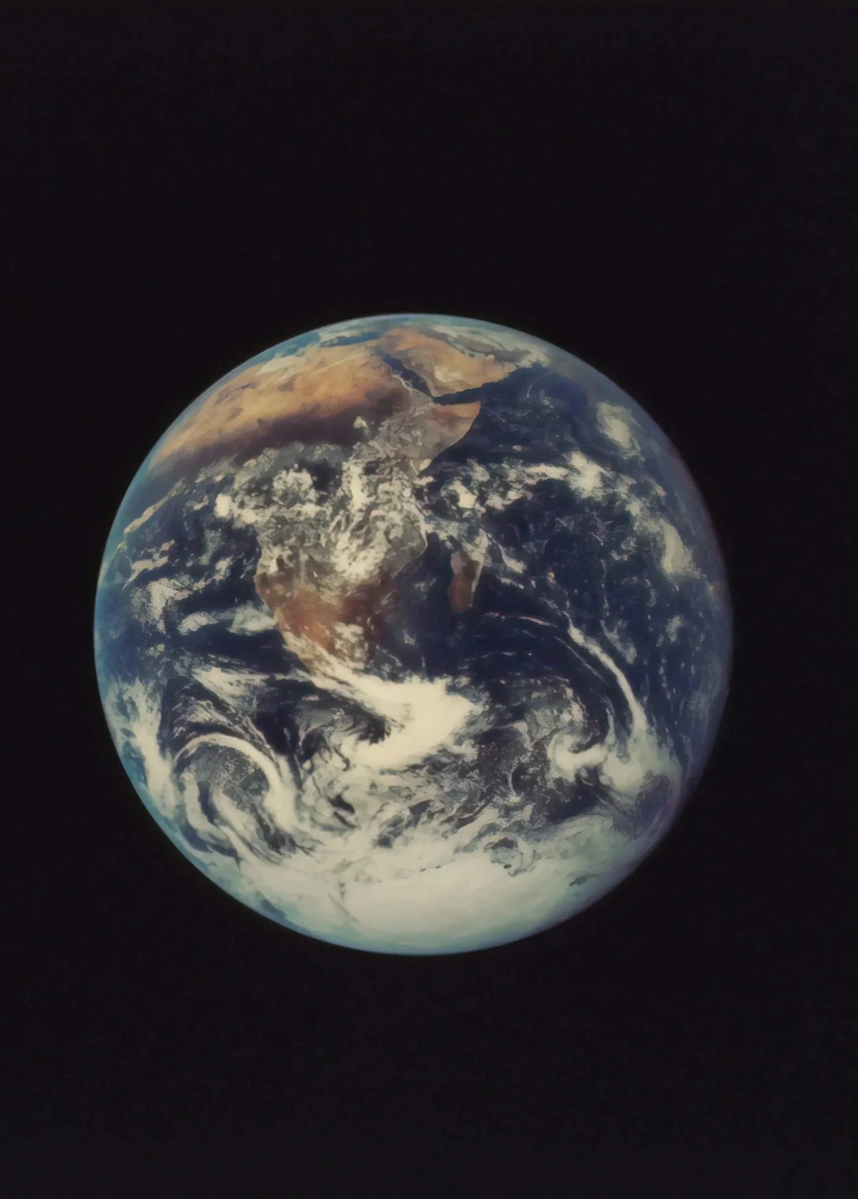 Photograph of planet Earth against a black background, showing Asia, Australia, and the surrounding oceans.