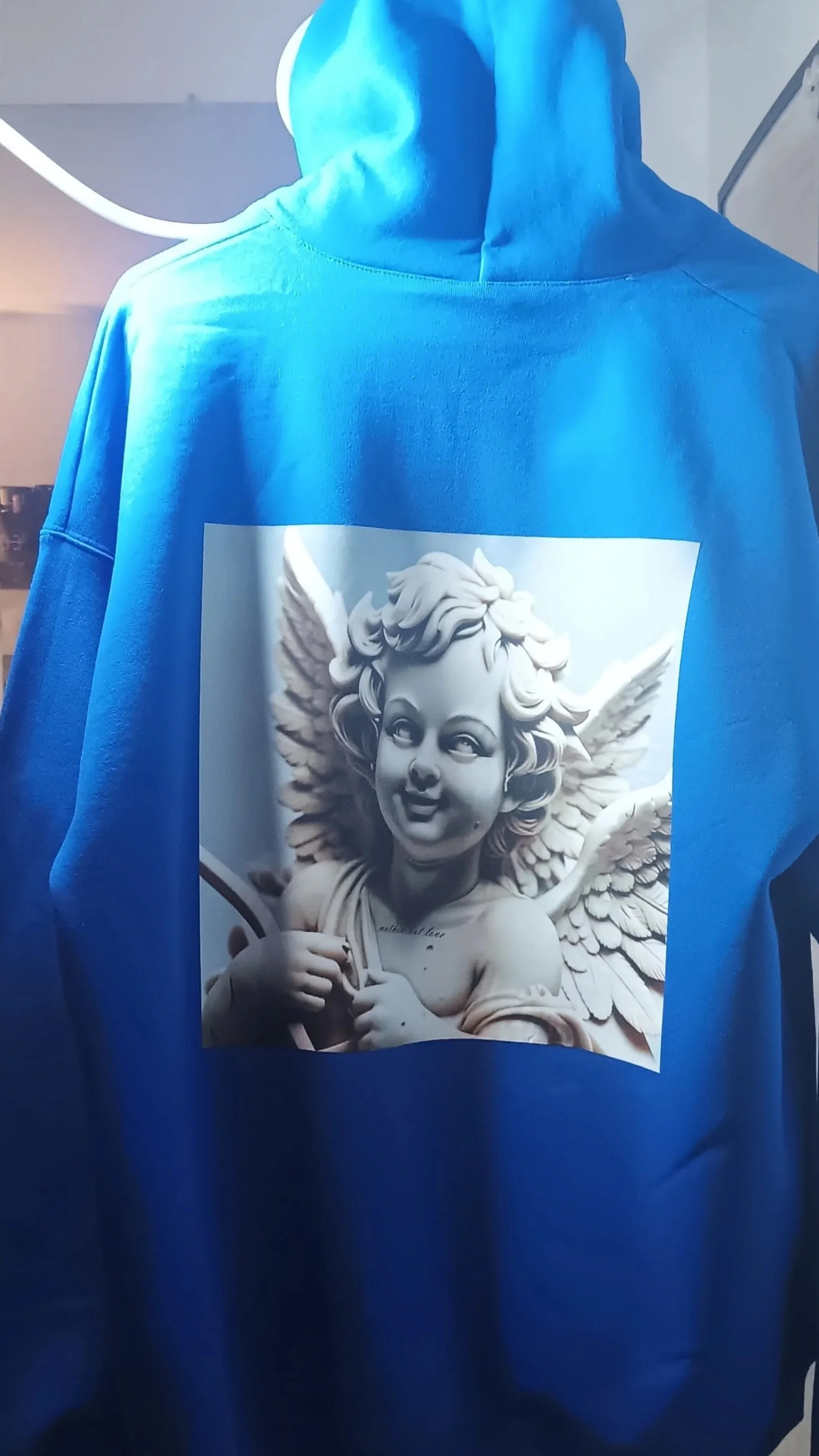 The "Nothin but Luv" Collection. A marble white triple winged cherubim graphic art. 