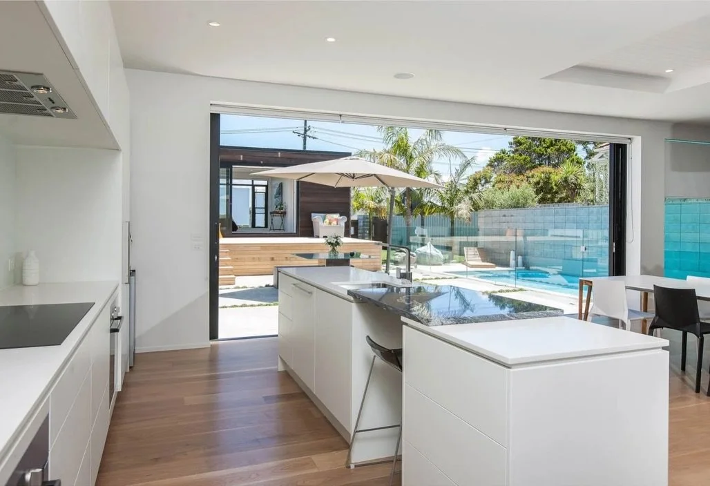 Open-plan living with natural light, combining pre-cast walls, tray deck mid floors, and a strong connection to the outdoor spaces.