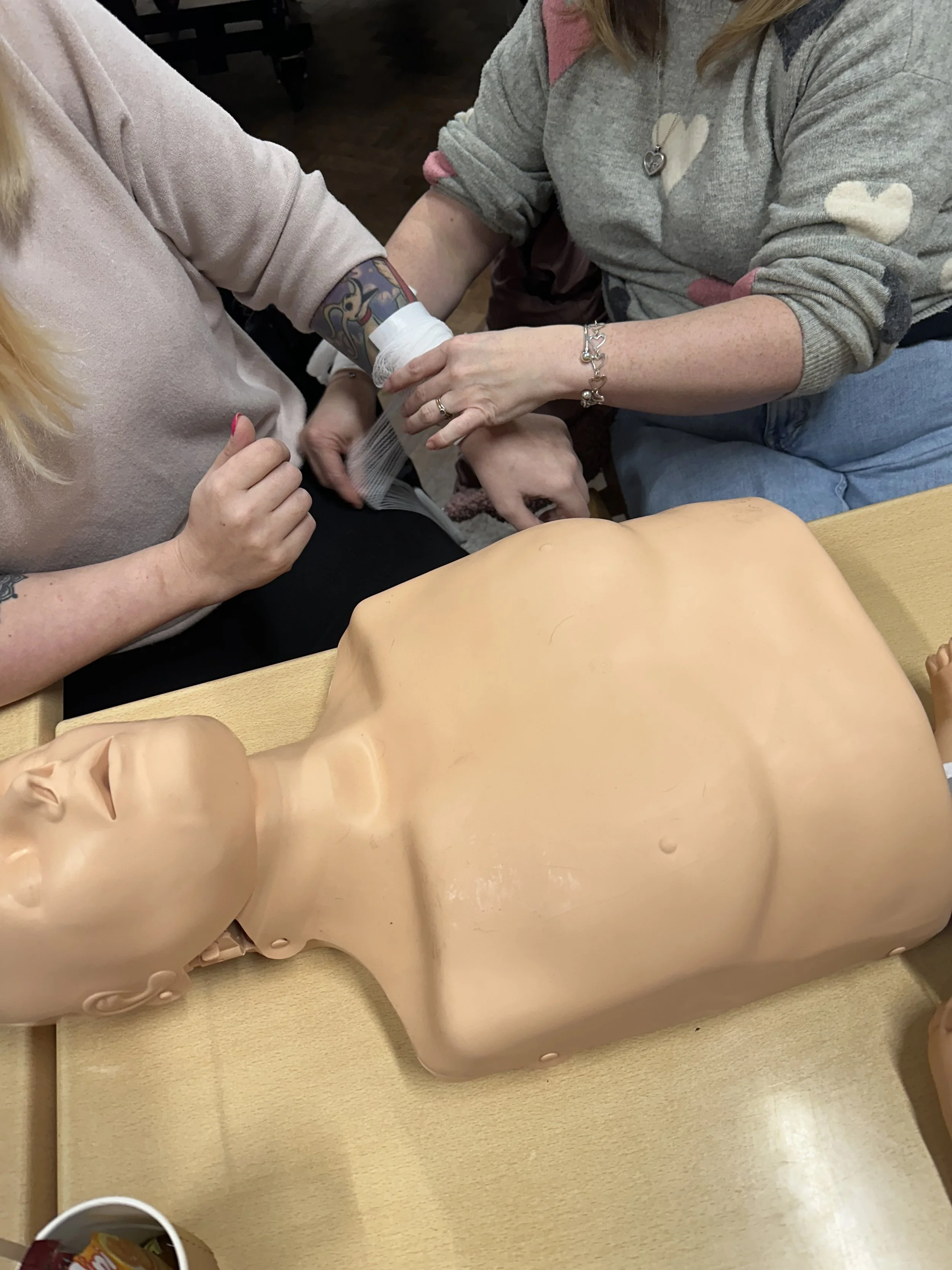 Practising bandaging on each other