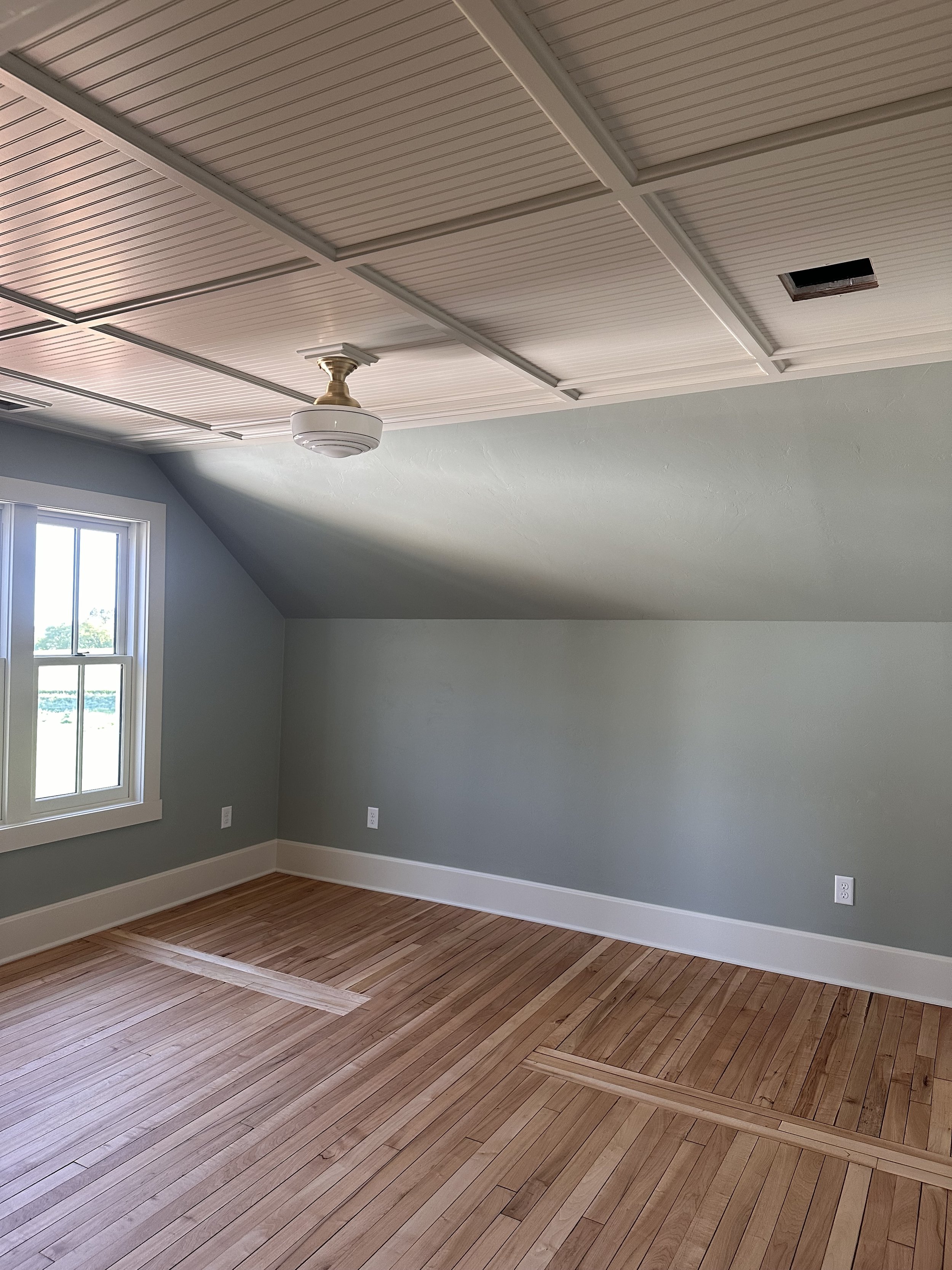Ceiling bead board and batten + trim install; customer asked for a hardwood patch to highlight previous wall location to “tell the story” of the room