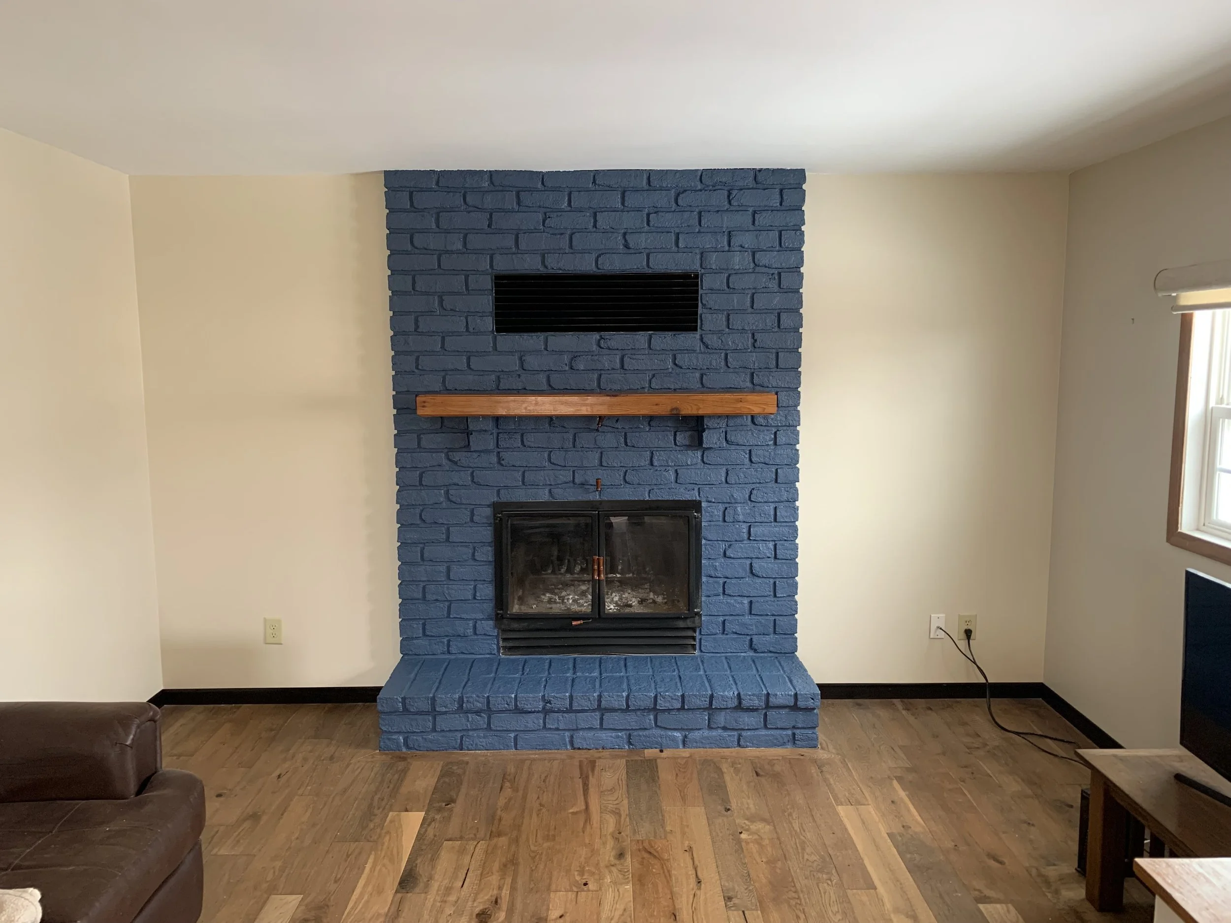 Drywall repair and painting of old bring fireplace