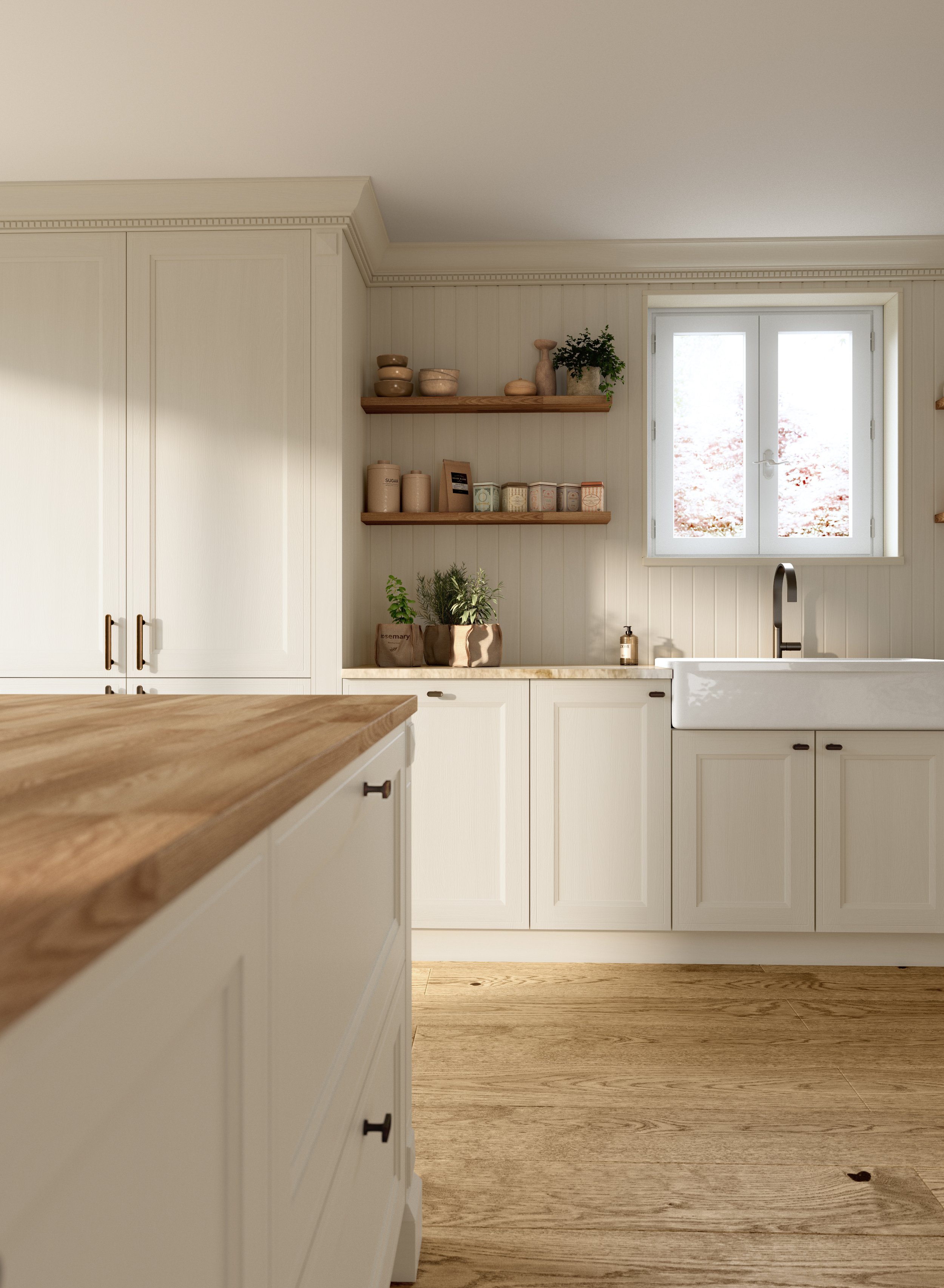 Cuisine lumineuse avec armoires blanches, plan de travail en bois, éviers en porcelaine, étagères en bois avec des bocaux et des décorations, fenêtre laissant entrer la lumière naturelle.