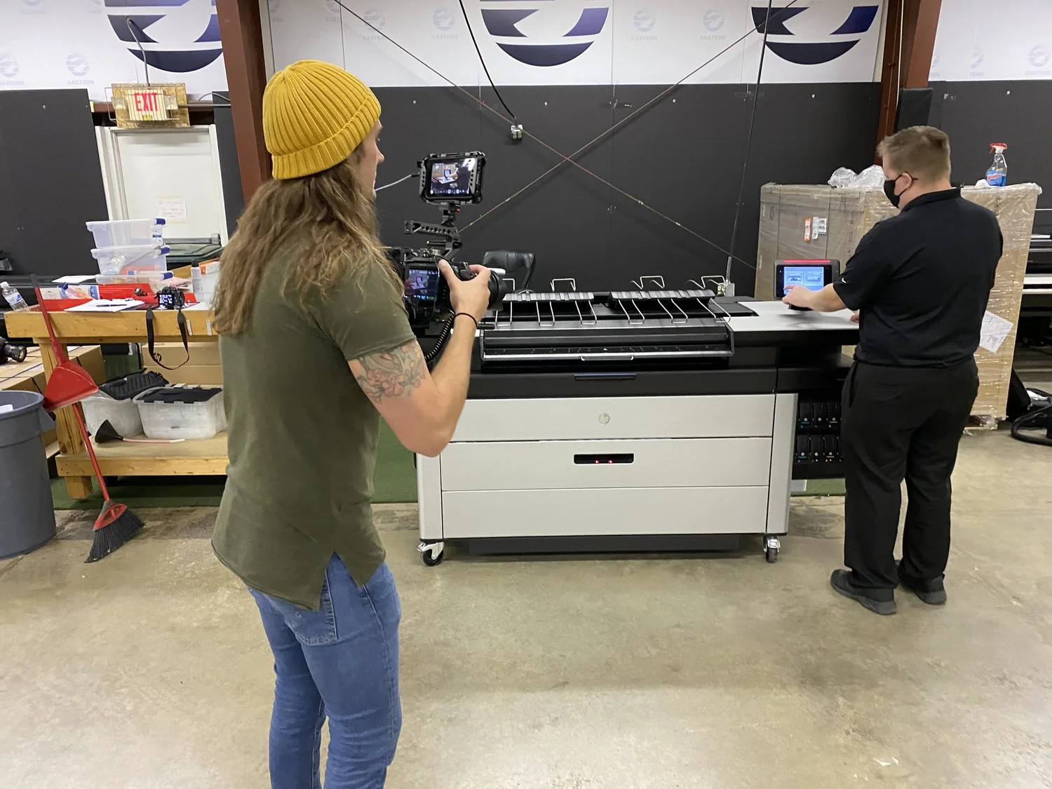 Bone Hook Media filming on location in a print shop