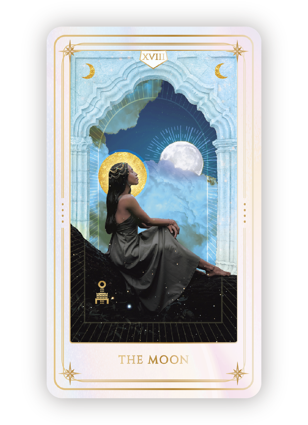 A tarot card titled "The Moon" featuring a woman sitting on a rock, with a full moon and clouds in the background, decorated with celestial symbols and gold accents.