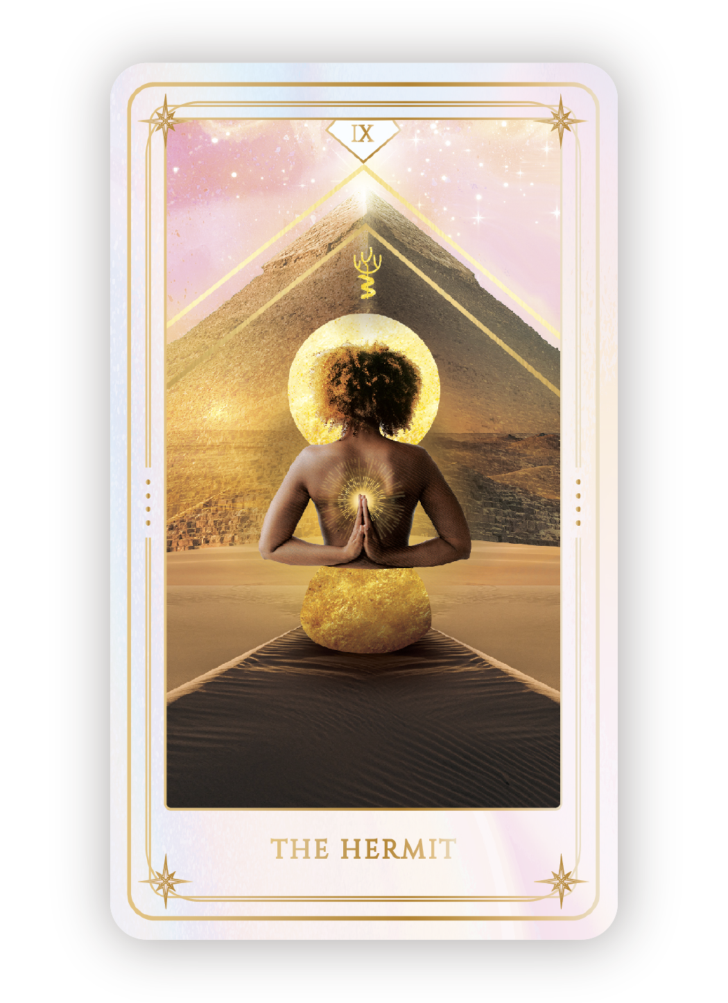 Tarot card titled "The Hermit" depicting a person with a tree for a head, kneeling in a desert with a pyramid and a starry sky in the background. The person has their hands in prayer position with a glowing light at their heart, and a large golden sp