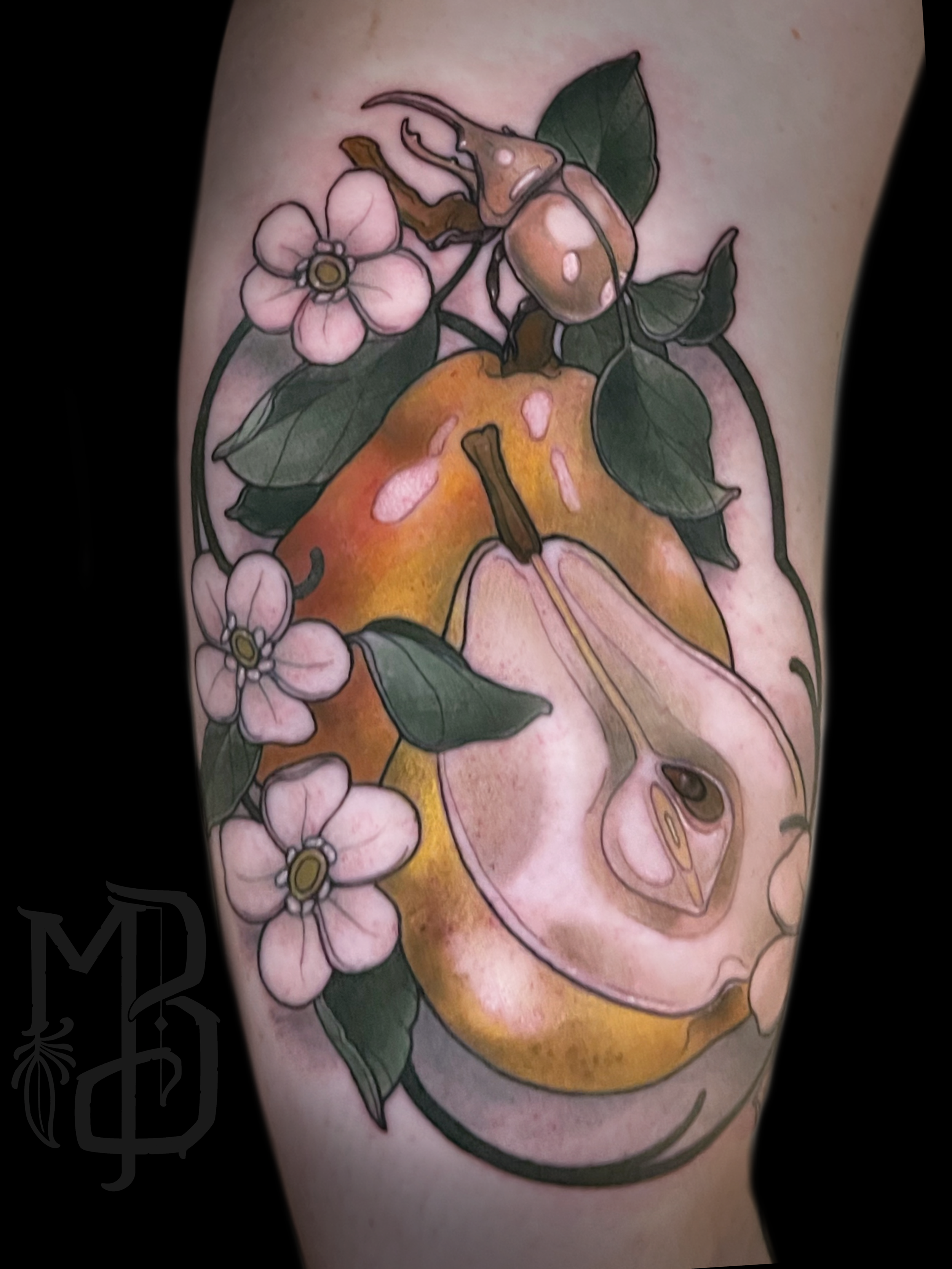 Colorful tattoo in neotraditional style of a pear with a sliced half showing seeds, surrounded by pink flowers and green leaves.