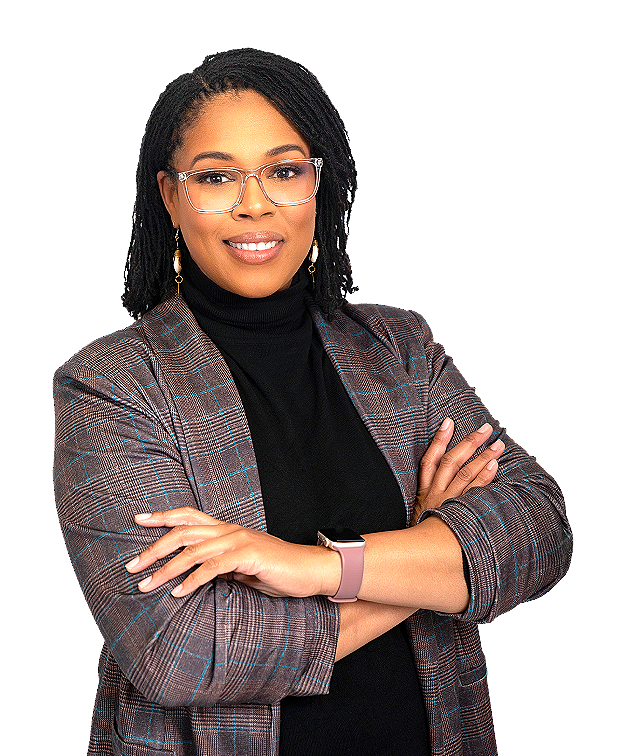 A confident African American woman with glasses, wearing a plaid blazer over a black turtleneck, with her arms crossed and smiling.