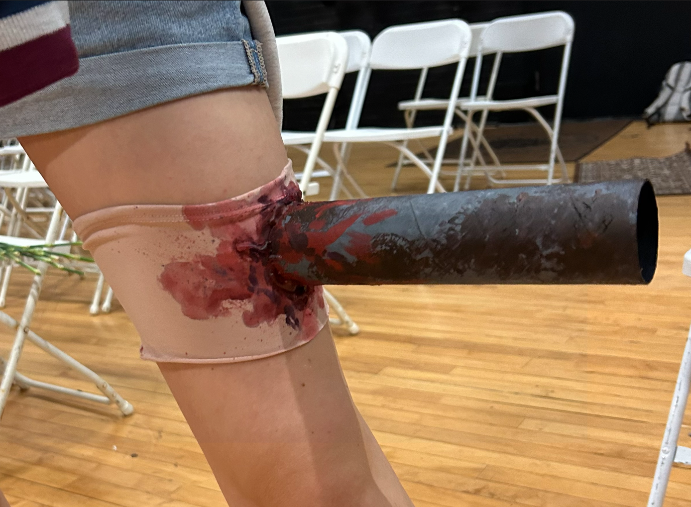 Metal pipe leg wound made from paper towel role and acrylic paint