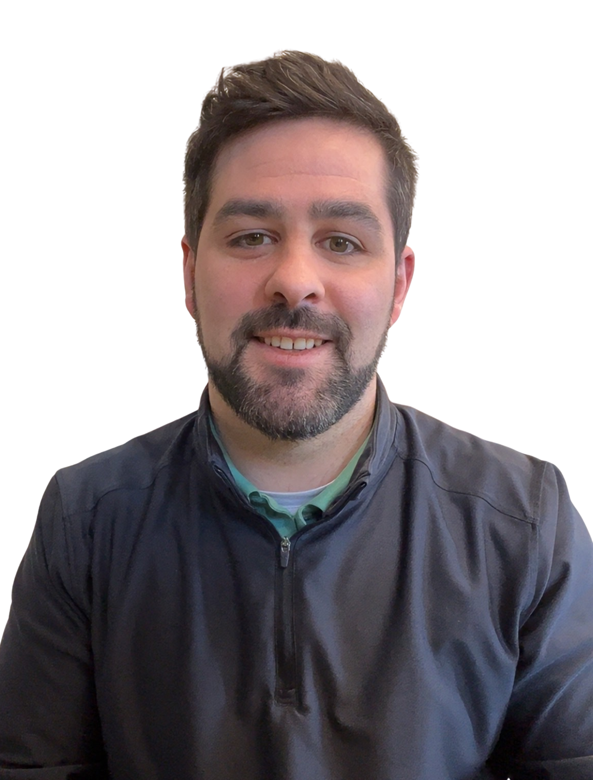 A smiling man with short brown hair, a beard, and a mustache, wearing a black jacket over a green collared shirt, against a plain background.