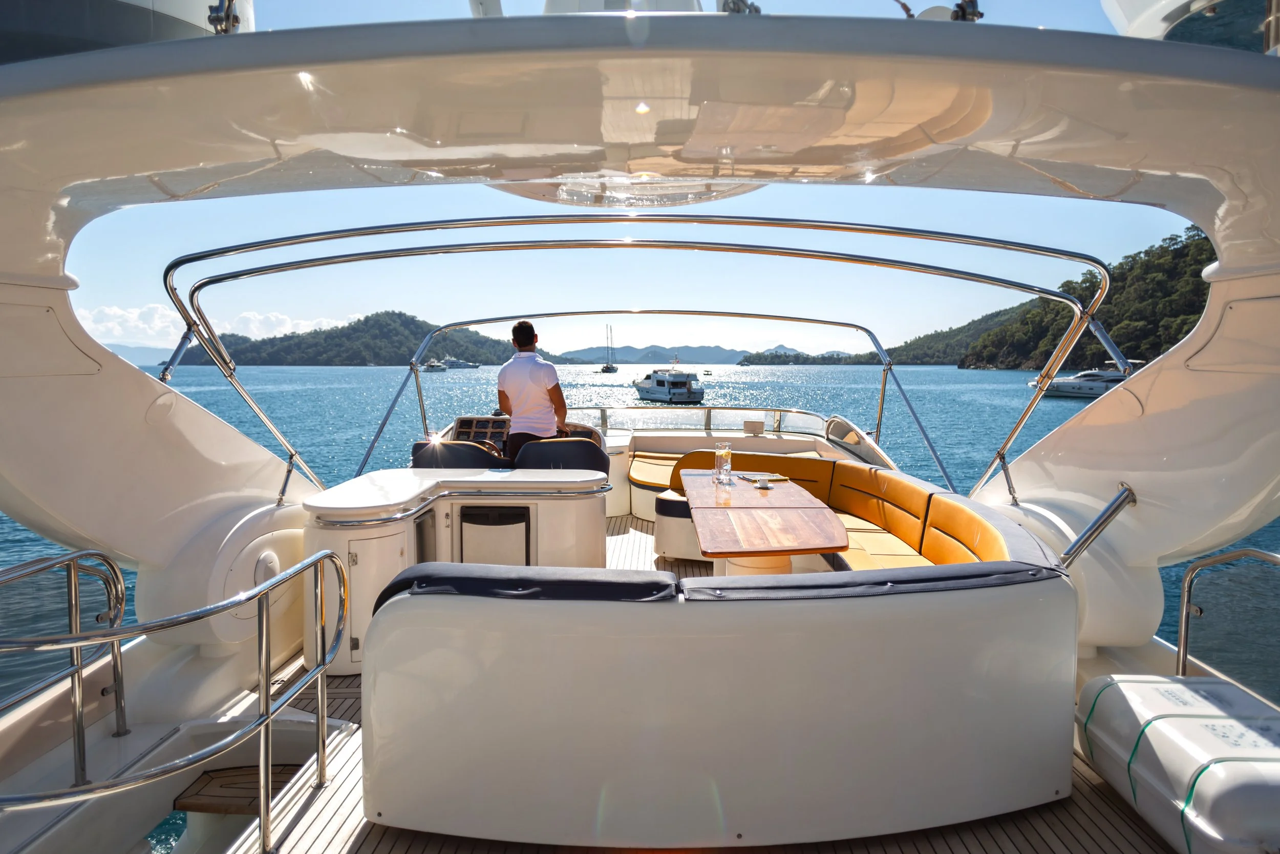 Crew operating a motor yacht.