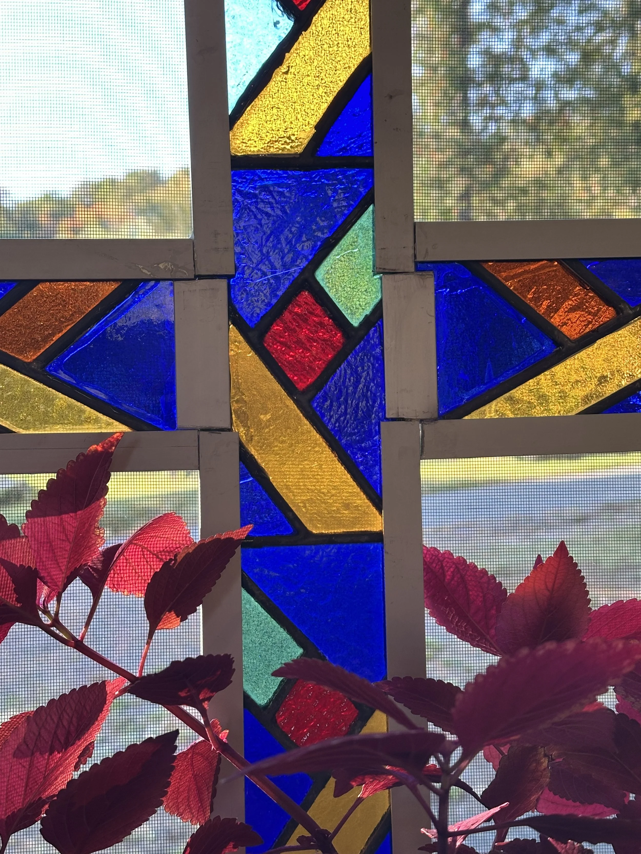 Stained Glass Cross in Window