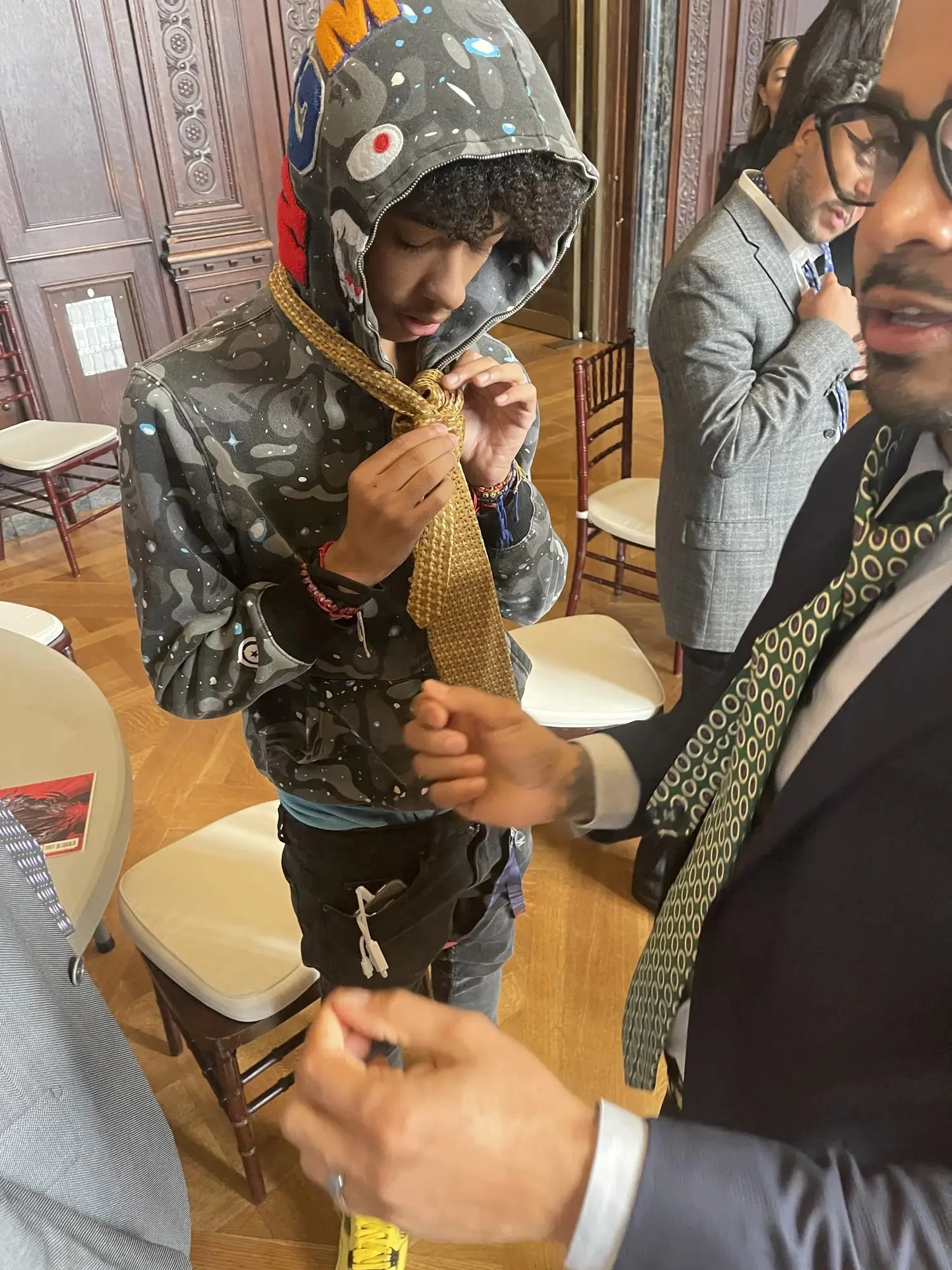 A young participant learning a practical skill with community mentors