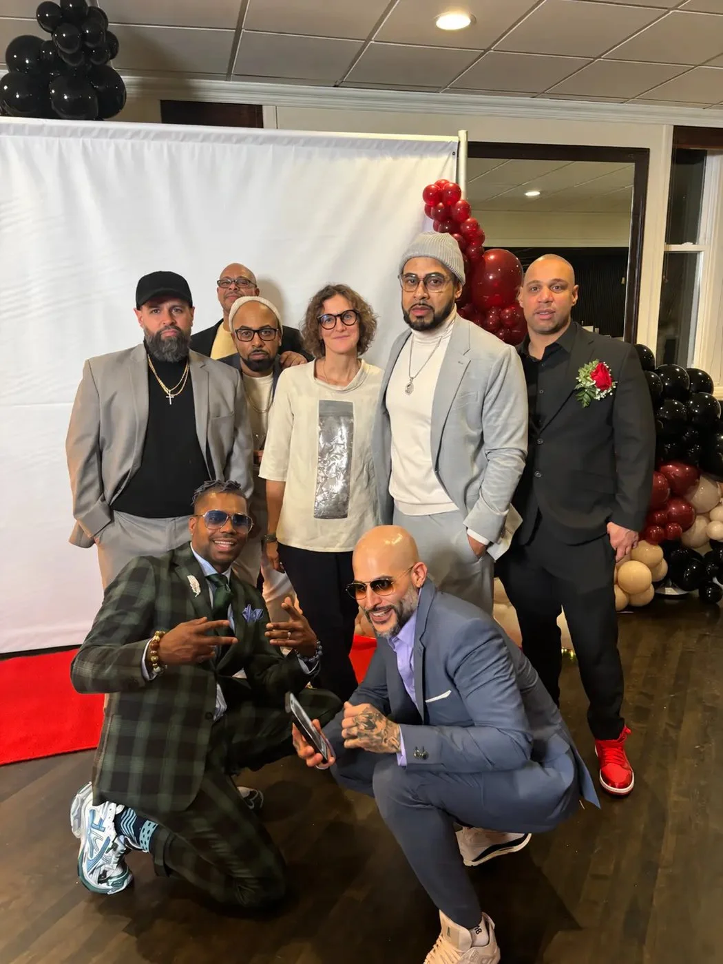 LeBron Legacy founder with community partners posing together at a celebration