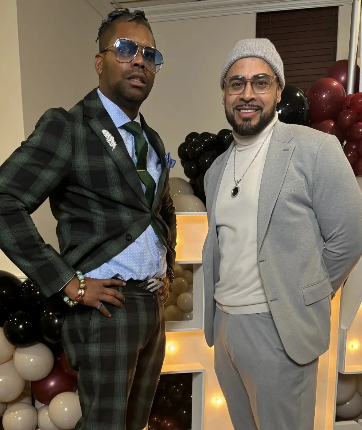 Two community leaders posing together at a formal event