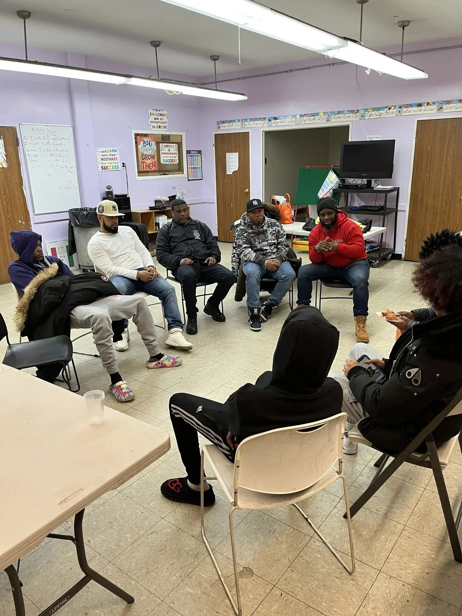 A community workshop arranged in an open discussion circle